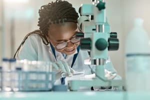 A scientist working with a mentor in a laboratory
